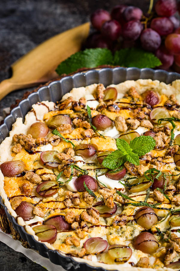 This savory Blue Cheese Grape Tart recipe has bold and interesting flavors. It makes a great appetizer or a decadent lunch paired with a green salad. #bluecheese #tart #grapes #redwine #walnuts #candiedwalnuts #appetizer #recipe #Vintijrestaurant #Vintij Blue Cheese Grape Tart