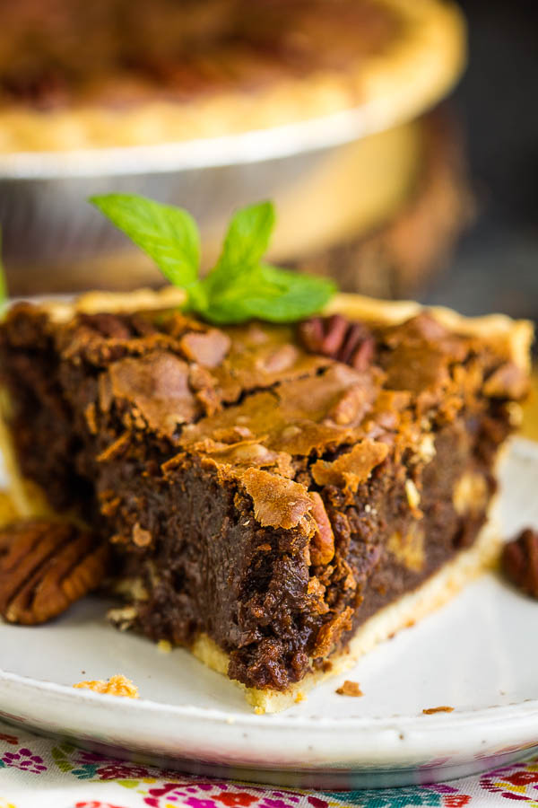 Rich, indulgent, and gooey, Chocolate Fudge Pecan Pie Recipe is quick and easy, requires no mixer, and has no corn syrup! It's a delicious new classic! #chocolate #fudge #pecan #pecanpie #chocolatepie #dessert #recipe Chocolate Pie with pecans