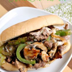 This Steak Escape Steak Sandwich has thinly sliced beef is cooked to perfection, melty cheese, peppers, onions, seasonings, and sauces. #steak #sandwich #recipe #beef #phillycheesesteak #cheesy