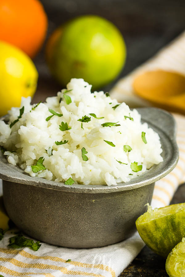 Chipotle's Cilantro Lime Rice Recipe is light, zesty, and fresh. This side dish brightens any meal and it's so easy to make! #lime #rice #cilantro #recipe #sidedish #Chipotle #copycat #TexMex Chipotle\'s Cilantro Lime Rice