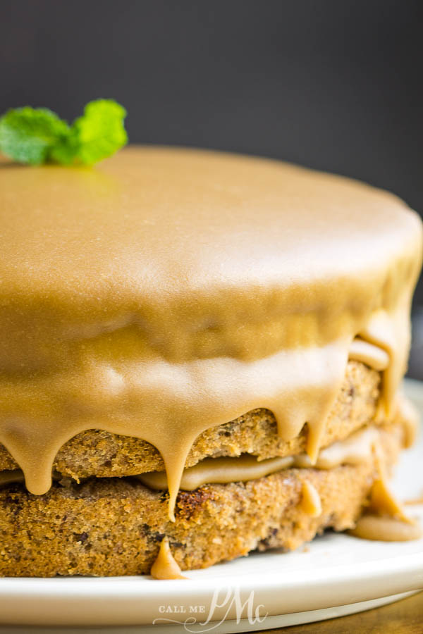 Three layer jam cake with caramel frosting dripping down sides Close-up of a dessert.