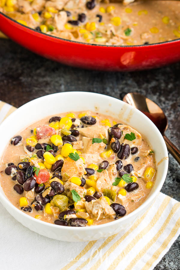 Southwest Creamy White Chicken Chili (stovetop & slow cooker method) is a cozy, satisfying, healthy meal of pure comfort. #soup #chili #chickenchili #whitechili #recipe #comfortfood #easy #Southwest #TexMex 