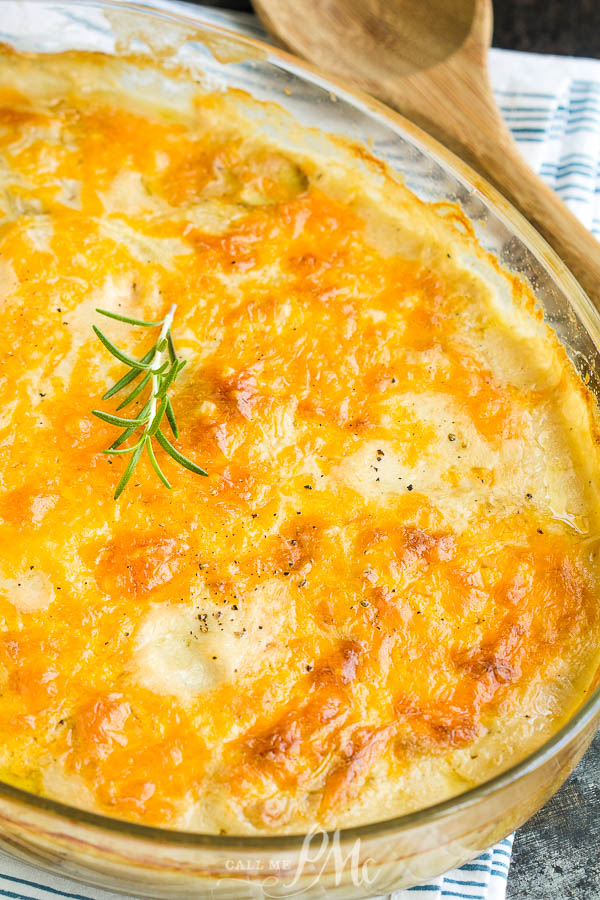 Classically delicious, Scalloped Potatoes with Cheddar, has tender buttery potatoes in a white sauce and topped with cheddar. #potatoes #cheese #casserole #sidedish #recipe #easy 