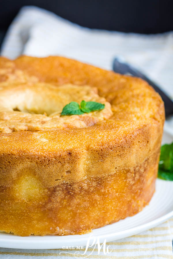 A 5 flavor pound cake on white cake plate.