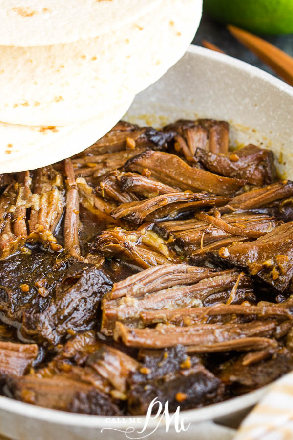 Delish Slow Cooker Korean Beef is simple yet full of flavor. Perfect comfort food on a chilly winter night. #beef #roast #slowcooker #chuckroast #recipe #Korean #Asian Delish Slow Cooker Korean Beef
