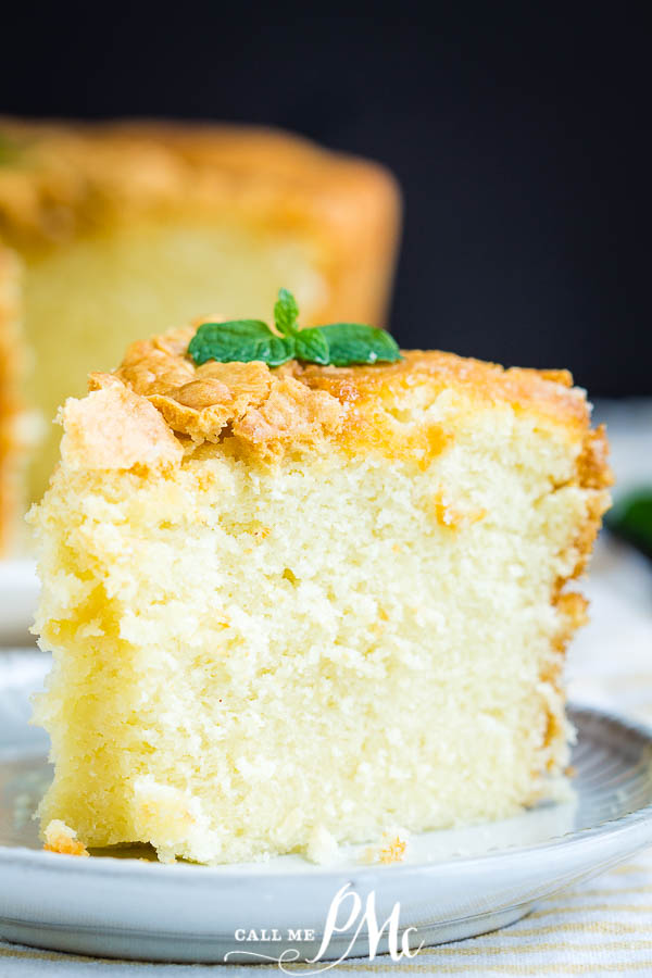 Plated slice of moist pound cake garnished with fresh mint sprig.