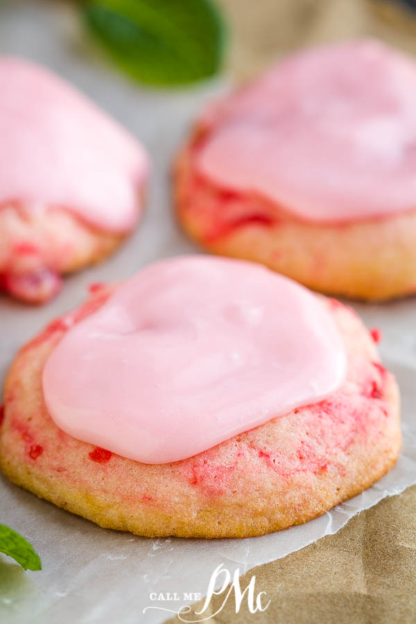 Frosted Amish Cherry Sugar Cookies are crispy around the edges yet pillowy soft and chewy inside. They get their pink color, great flavor, and soft texture from maraschino cherries. #cookies #cherrycookies #shirleytemple #shirleytemplecookies #homemade #recipes #dessert #Christmascookies 