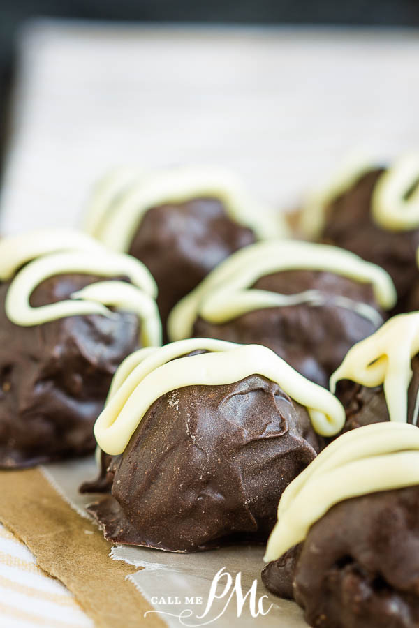 Dangerously-delicious, rich, and decadent, KitKat Truffle Recipe is an easy 3 ingredient, no-bake recipe that's perfect to make with children and to give as gifts for the holidays. #truffles #recipes #candy #chocolate #dessert #gift #Kitkat #candybar Chocolate candy in a row.