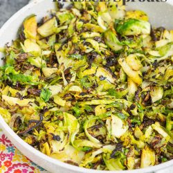 A fast and easy recipe for Brussels sprouts, Carmaelzied Shaved Brussels Sprouts are perfectly cooked, have great texture, and make a healthy side dish. #Brusselssprouts #recipe #sidedish #healthy #keto #lowcarb
