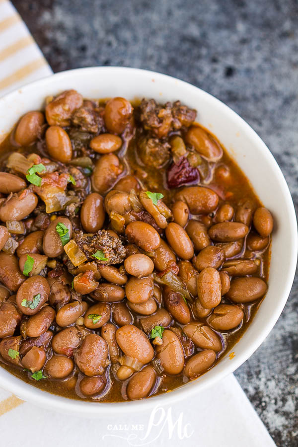 Slow Cooker Pinto Beans and Sausage are simple to make with incredible flavor. These beans slow-cooked all day for some delicious comfort food.