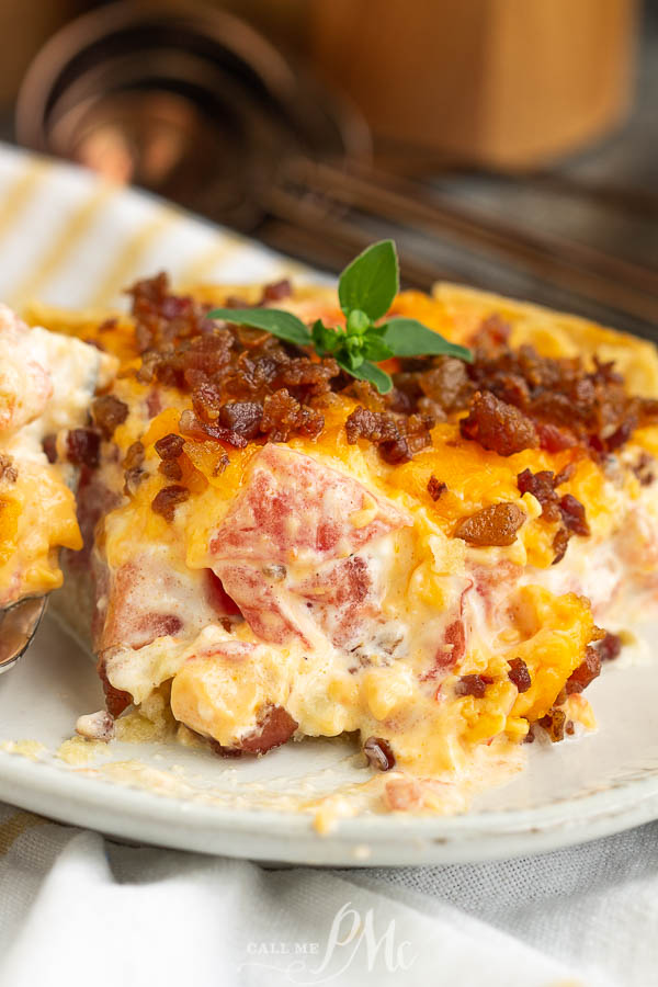 slice of savory pie with cheddar, bacon, and tomatoes serving of tart