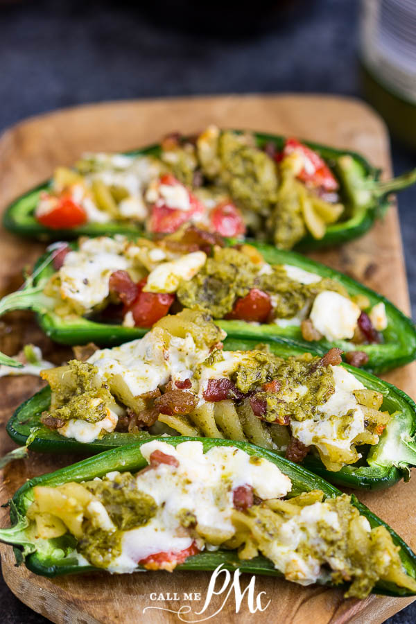 These jalapeno peppers are stuffed with pesto pasta, tomatoes, and cheese. The perfect snack, appetizer, or side.