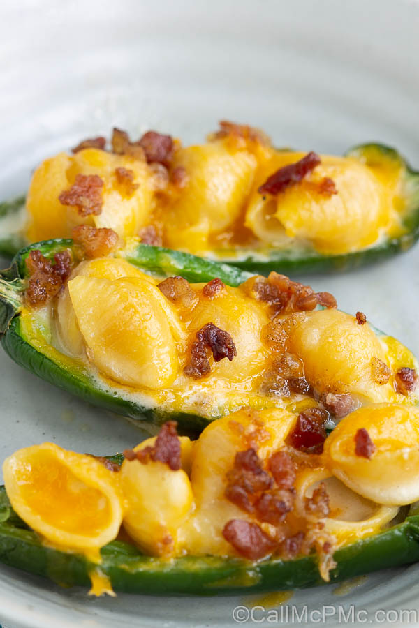 Mac and Cheese Stuffed Jalapeno Poppers are filled with homemade mac and cheese and topped with salty, crispy bacon.