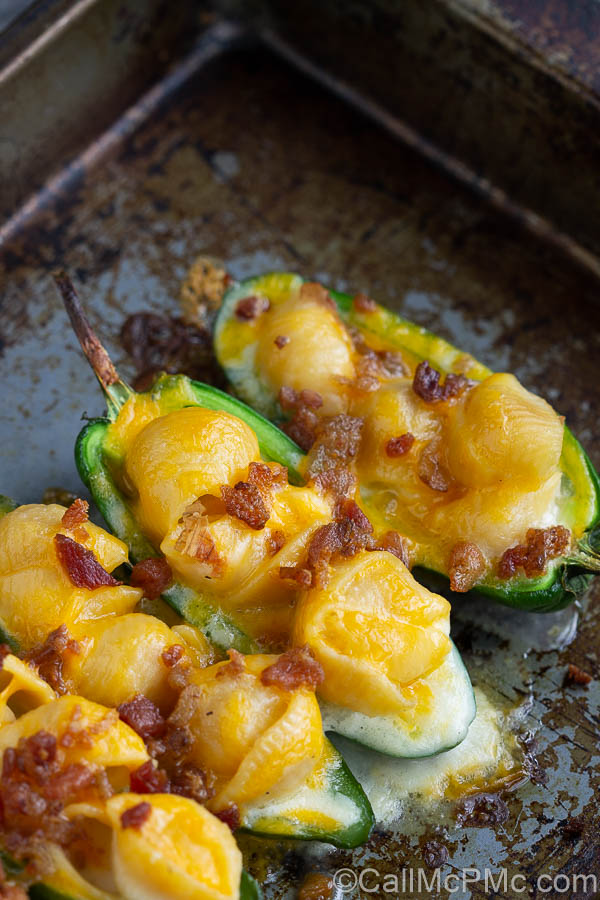 Mac and Cheese Stuffed Jalapeno Poppers are filled with homemade mac and cheese and topped with salty, crispy bacon.