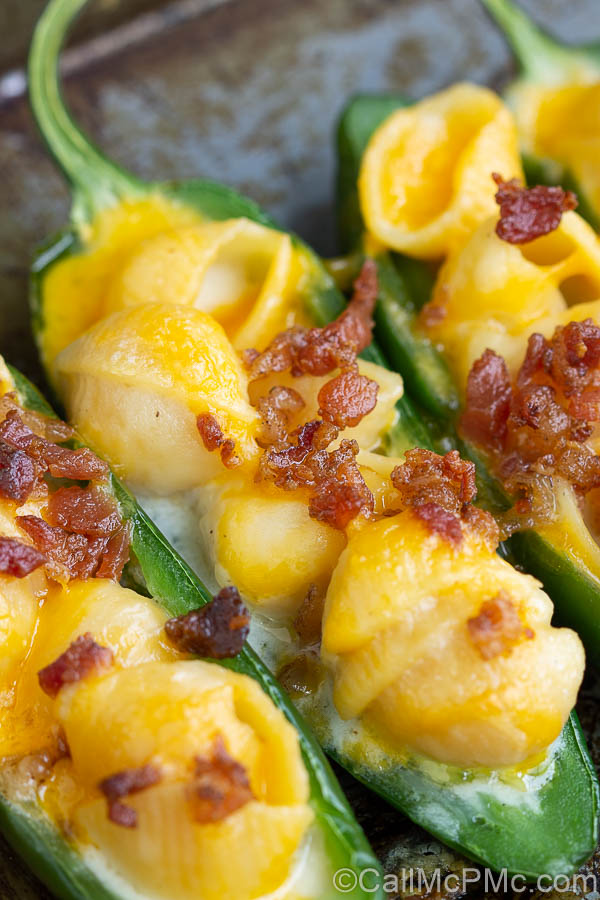 Mac and Cheese Stuffed Jalapeno Poppers are filled with homemade mac and cheese and topped with salty, crispy bacon.