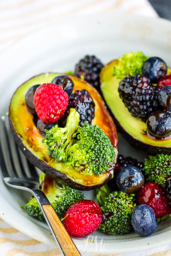 berries, and broccoli filled avocados