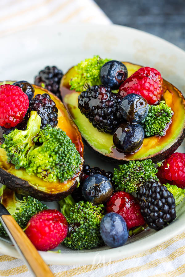 berries, and broccoli filled avocados