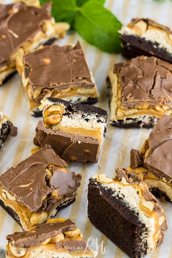 Snickers Brownie Bars - Rich, fudgy brownies are topped with a fluffy nougat, creamy caramel, crunchy peanuts, and dark chocolate.