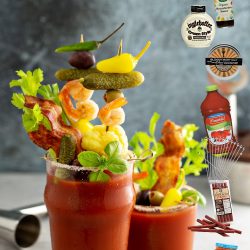 Bloody mary cocktail topped with variety of generous garnishes