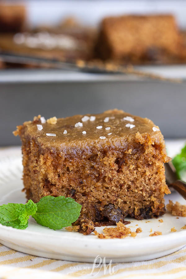 Applesauce Walnut Spice Cake with dates and caramel frosting is a moist, old-fashioned recipe, and one of my family's favorite fall cakes.