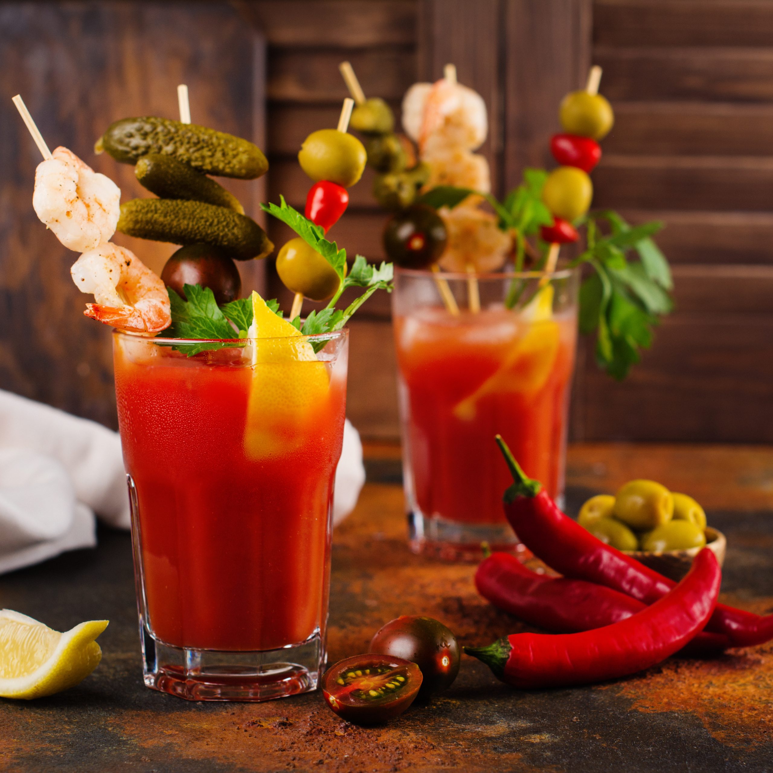 Bloody mary cocktail topped with variety of generous garnishes