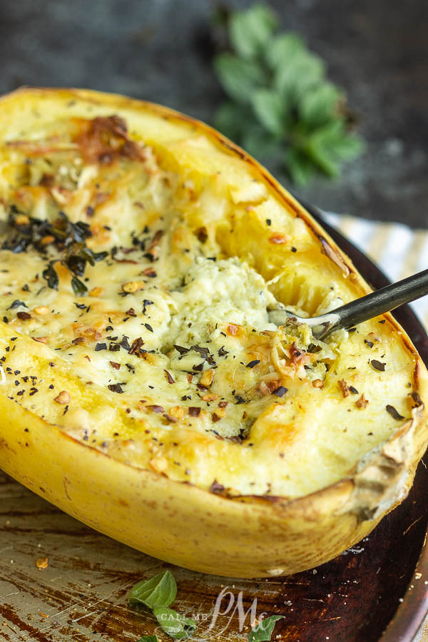 Cheese filled squash half with fork