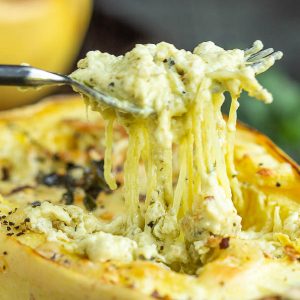 Roasted Cheesy garlic spaghetti squash is combined with a few simple ingredients for a fantastic healthy side dish that goes with everything.