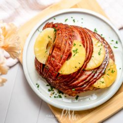 An Instant Pot Pineapple Brown Sugar Ham on a plate.