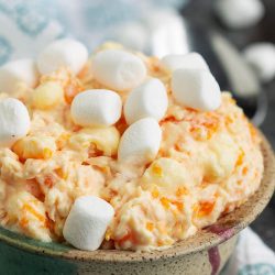 Orange Creamsicle Fluff with Cottage Cheese recipe is a family favorite fruit salad with Cool Whip, mandarine oranges, and marshmallows.