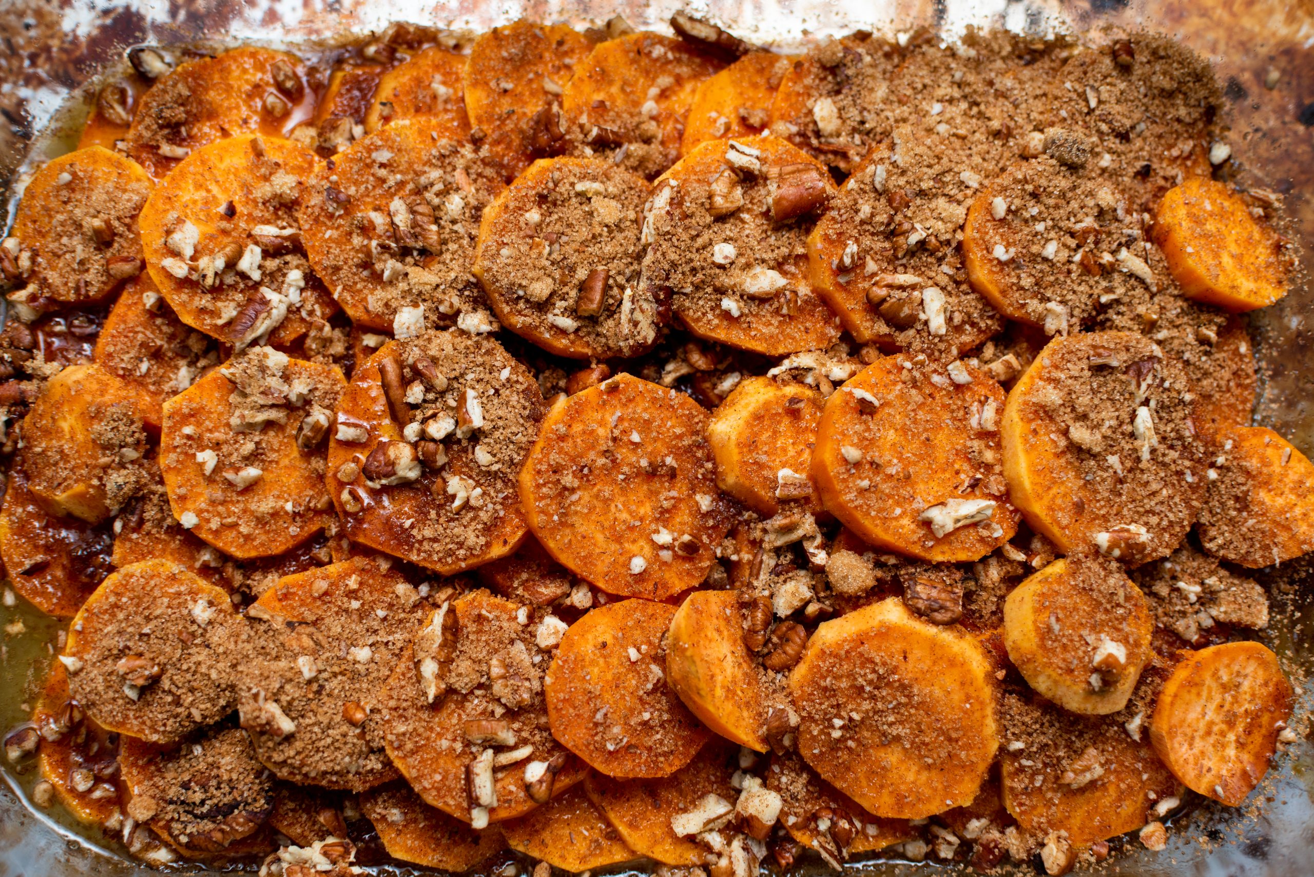 unbaked sweet potatoes in casserole dish