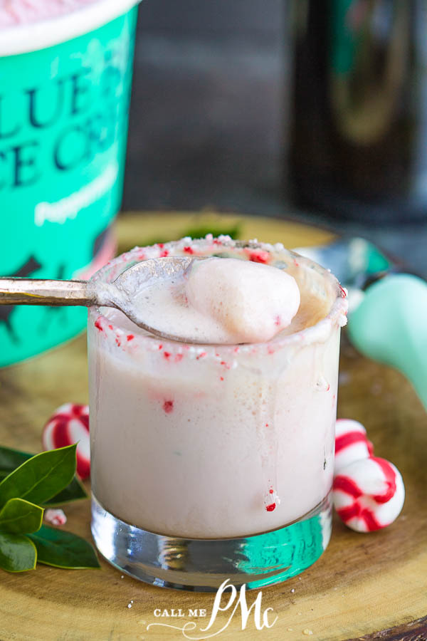 Peppermint drink spoonful of peppermint ice cream float resting on top of a glass.