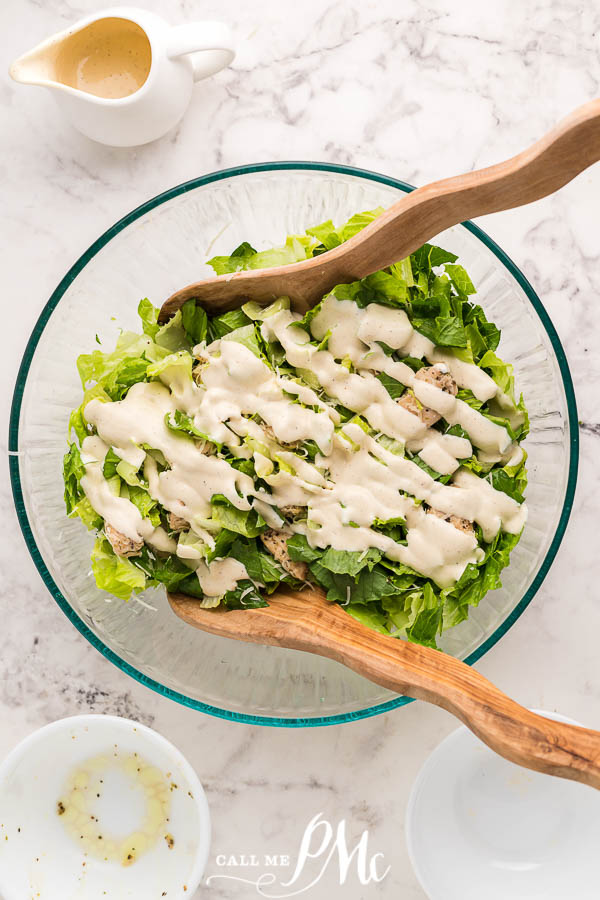 salad in bowl with dressing drizzled on top