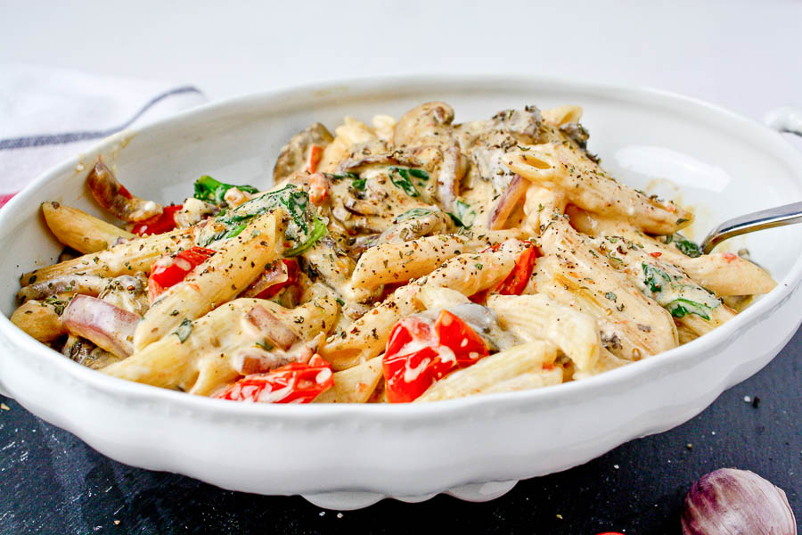 bowl of pasta Creamy Pasta with Spinach and Tomatoes