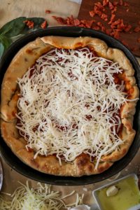 Chicago-style deep dish pizza with a super flavorful crust, stringy mozzarella, tomato sauce, and pepperoni