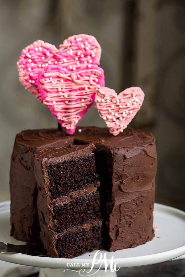 slice of chocolate cake with heart decorations slice of chocolate cake with hearts