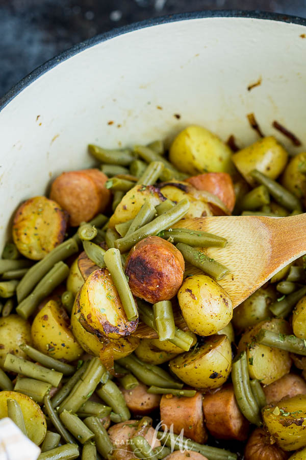 pot with vegetables and sausage sausage and vegetables in skillet