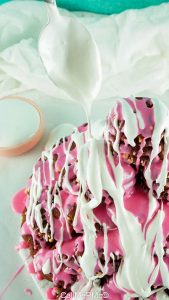 red velvet cookies decorated with white and pink frosting