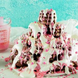 Red Velvet Cookie recipe and How to build a cookie tree. Cookies are stacked to resemble a tree then decorated with frosting & sprinkles.