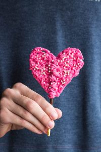 Chocolate Pocky Heart Decorations are the easiest and most festive topper for your Valentine's cake. They double as a chocolate treat too!