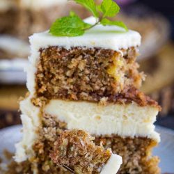 Cheesecake Layered Carrot Cake Recipe. Scrumptiously creamy and rich, a silky smooth cheesecake is sandwiched between two flavorful carrot cake layers then smothered with cream cheese frosting.