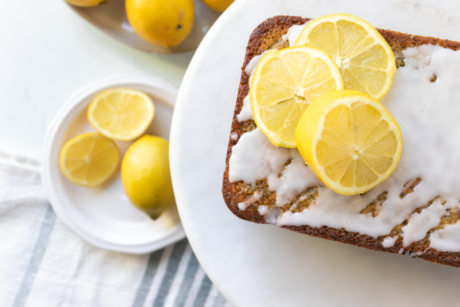 Flatlay of lemon dessert cake with lemon slices.