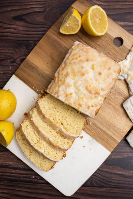 Iced Lemon Loaf Half Pound Cake Recipe. This simple half pound cake is flavored with lemon then smothered with a lusciously thick layer of lemon glaze.