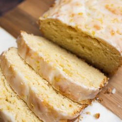 Iced Lemon Loaf Half Pound Cake Recipe. This simple half pound cake is flavored with lemon then smothered with a lusciously thick layer of lemon glaze.