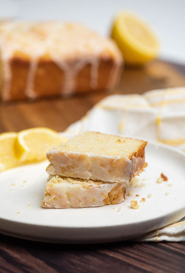Iced Lemon Loaf Half Pound Cake Recipe. This simple half pound cake is flavored with lemon then smothered with a lusciously thick layer of lemon glaze.