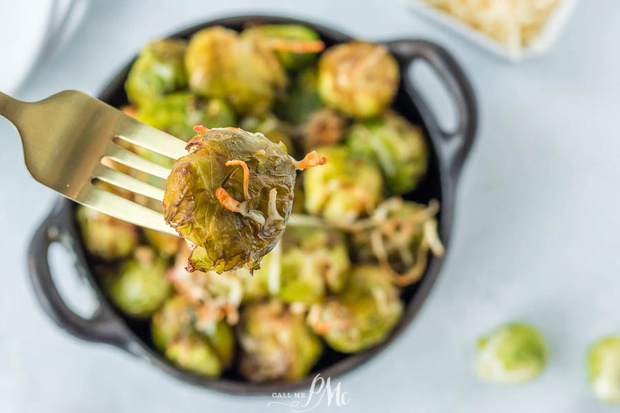 Smashed Brussels Sprout on a fork air fryer brussel sprouts on a fork.