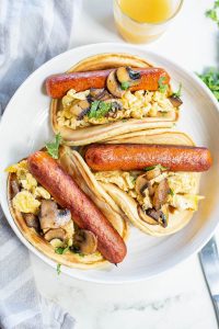 The best breakfast, Sausage Pancake Tacos, is loaded with sausage and scrambled eggs then stuffed in a homemade pancake.