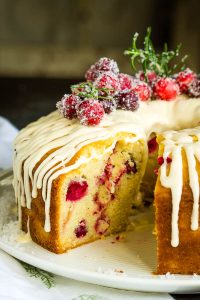 White Chocolate Cranberry Bundt Cake has fresh cranberries, Greek yogurt, and white chocolate making it rich and luscious.