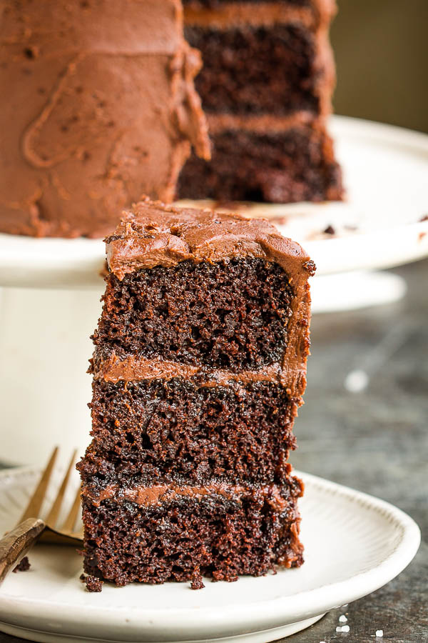 slice of chocolate layer cake on white plate.