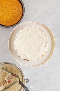 This cake is bursting with layers of bright summer citrus flavor. This cake mix cake tastes like a fancy bakery cake from the addition of sour cream, pudding, and Jello. Topped with luscious buttercream and lemon, lime, and orange slices, this Citrus Cake is perfect for spring!