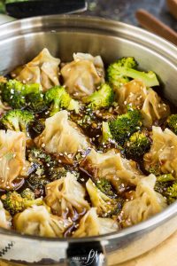 General Tso Potstickers by Call Me PMc are filled with chicken, quinoa, onions, garlic, & soy then cooked in a  sweet, spicy, and tangy sauce with broccoli.